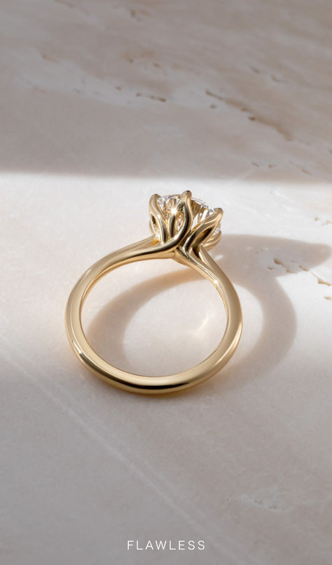 This simple claw prong solitaire features an open basket with six elegant leaves that delicately cradle the center diamond. Two Tone Solitaire Engagement Ring, Tulip Prong Engagement Ring, Unique Solitaire Engagement Ring, Yellow Gold Solitaire Engagement Ring, Gold Solitaire Engagement Ring, Yellow Gold Engagement Ring, Yellow Gold Solitaire, Round Solitaire, Claw Prong