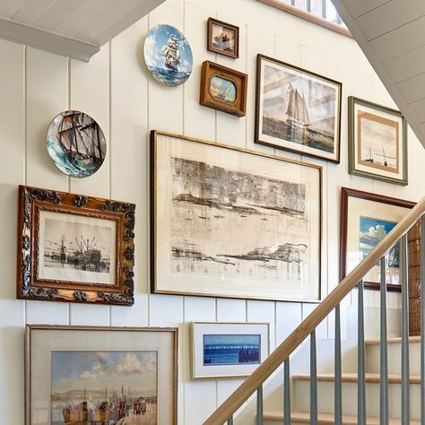 FRAN KEENAN DESIGN on Instagram: "It's no secret... we LOVE a good gallery wall around here! This one is from our Blue View project in lovely 30A. We opted to adorn every wall of the stairway in collected, nautical themed pieces for a cohesive look with big impact. 🌊 ⁠" Blue Themed Wall Art, Beach Gallery Wall Ideas, Coastal Gallery Wall Bedroom, Beachy Gallery Wall, Gallery Wall On Navy Blue Wall, Nautical Hallway, Beach Art Gallery Wall, Beach Theme Gallery Wall, Vintage Coastal Gallery Wall