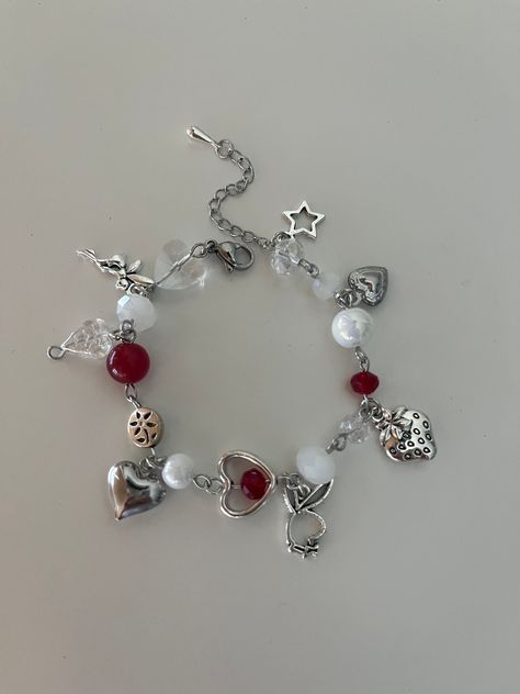 This handmade beaded charm bracelet is a simple but chic addition to any outfit. The bracelet features high quality glass beads and stainless steel charms, making it durable and non-tarnish. The red and silver accents offer a stylish and classic look. Bracelets Red, Friendship Bead Bracelets, Charm Bracelets, Red Beaded Bracelet, Goth Accessories, Jewelry Set Design, Bracelet Craft Diy, Bracelets Design, Diy Bracelet Designs