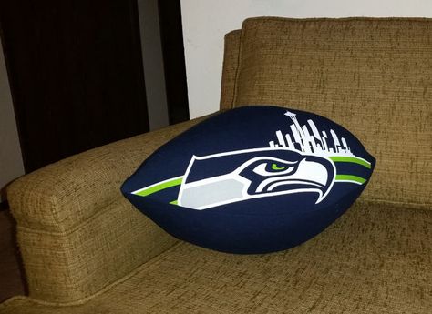 Turn your lucky T-shirt into a lucky football pillow. Football Pillow, Football Pillows, Sports Wreaths, Patriots Football, Memory Crafts, Pillow Tutorial, A Football, Diy Pillows, Seattle Seahawks