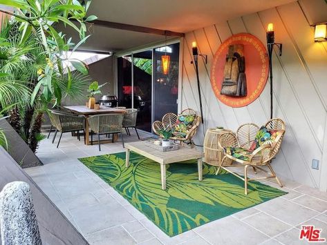 Polynesian Decor in Midcentury Modern Condo Is Tiki-Terrific | realtor.com® Polynesian Decor, Tiki Patio, Tropical Patio, San Myshuno, Hawaiian Homes, Tiki Decor, Tiki Bar Decor, Tiki Lounge, Modern Condo