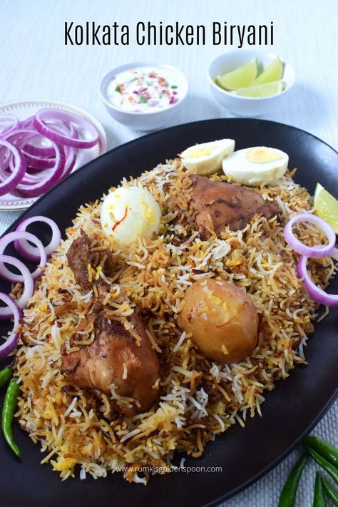 bengali chicken biryani recipe, kolkata chicken biryani, kolkata style chicken biryani, kolkata chicken biryani recipe, bengali chicken biryani, recipe of kolkata chicken biryani, chicken biryani bengali style, bengali style chicken biryani, kolkata style chicken biryani recipe, kolkata arsalan chicken biryani recipe, kolkata biryani, kolkata biryani recipe, kolkata biryani masala, kolkata arsalan biryani, bangla chicken biryani recipe, authentic kolkata chicken biryani recipe Kolkata Biryani, Bengali Chicken, Saffron Milk, Chicken Biryani Recipe, Popular Dishes, Chicken Biryani, Chicken Pieces, Chicken Gravy, Biryani Recipe