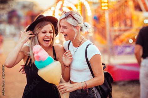 Stock Image: Shot of happy female friends in amusement park eating cotton candy. Two young women enjoying a day at amusement park. Eating Cotton Candy, Ying Yang Twins, Amusement Park Outfit, Big And Rich, Concert Series, Thrill Ride, Park Photos, Cruise Port, Female Friends