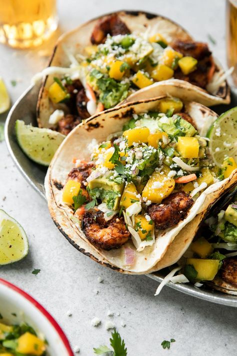 When it comes to dinners, these Grilled Shrimp Tacos are a must-try! Summertime grilling brings all the best flavors to the table. These shrimp tacos pack a little heat with ancho chili powder and cumin in the marinade but they're cooled down perfectly with a homemade chunky Mango Avocado Salsa. Grilled Shrimp Tacos, Ancho Chili Powder, Mango Avocado Salsa, Ancho Chili, Mango Avocado, Avocado Salsa, Shrimp Tacos, Grilled Shrimp, Chili Powder