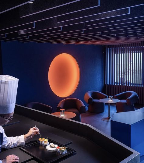 This two Michelin-star restaurant in Italy features a bar lounge immersed in blue and neon orange light - Yanko Design Restaurant In Italy, Udine Italy, Geometric Volume, Italian Bar, Blue Lounge, Internal Courtyard, Michelin Star Restaurant, Orange Light, Tiny House Interior