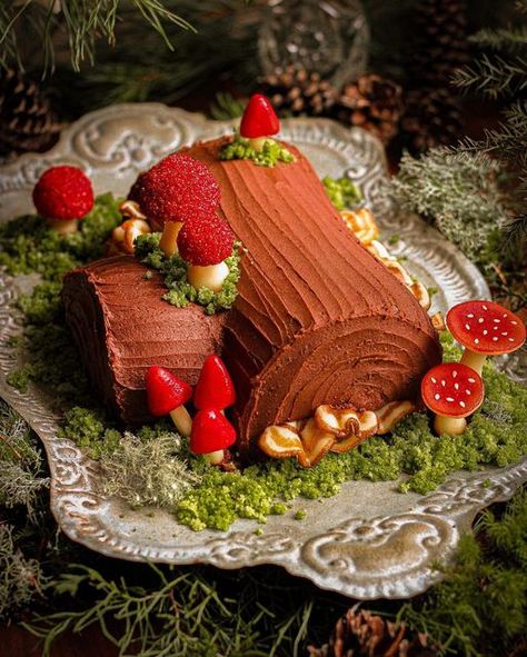 Must Love Herbs - Lauren May on Instagram: "✨🍄 An Enchanted Forest Yule Log or Buche De Noel 🍄✨ The mushrooms are made of hand sculpted and painted marzipan. The Moss is simply cake crumbs. I used natural elements such as lichen, moss, pine, cedar and pinecones to drive home the enchanted Forest feeling. The cake is Devil’s Food with a chocolate cream cheese filling and chocolate buttercream icing sculpted to look like tree bark. The recipe is in the last three slides! Also, keep an eye out because I’ll be making a TOTALLY different Yule log this week! 😍😍😍 #yulelog #buchedenoel #christmasbaking #devilsfoodcake #wildfoodlove #faeriemagazine #fantasticfungi #f52grams #f52community #feedfeed #feedfeedmagazine #foodblogfeed #birthdaycake #fungi #magnolia #goblinmode #goblincoreaesthetic" Goblincore Birthday, Fourest Birthday, Log Decorations, Cake Forest, Chocolate Buttercream Icing, Love Herbs, Forest Birthday Party, Yule Log Cake, Forest Birthday