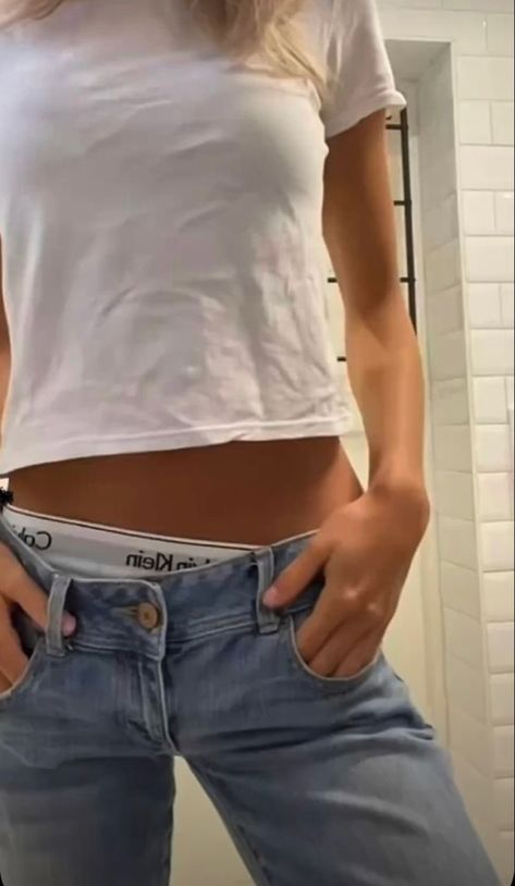 A woman wearing low rise jeans with showing Calvin Klein boxers and white baby tee Calvin Klein Outfits Woman, Calvin Klein Boxers Aesthetic, Boxers Under Jeans, Low Rise Jeans Y2k, Fashion Tomboy, Calvin Klein Boxers, White Baby Tee, Calvin Klein Outfits, Spring Outfit Idea