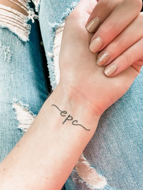 Initial Tattoo On Wrist For Women, Small Initial Tattoo On Wrist, Cute Initial Tattoos For Women, Three Initial Tattoo Ideas, Wrist Initial Tattoo, Kids Initials Tattoos For Women, Small Tattoos For Moms With Kids, Initial Tattoos For Women, Initials Tattoos For Women