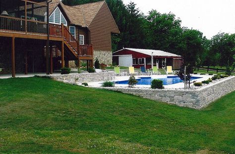 Backyard With Deck And Pool, Retaining Wall Around Pool Ideas, Retaining Wall Pool Sloped Backyard, Rectangle Pool With Retaining Wall, Pool With Retaining Wall Sloped Backyard, Pools With Retaining Walls Sloped Backyard, Pool With Retaining Wall, Pool Upgrades, Mod Pool