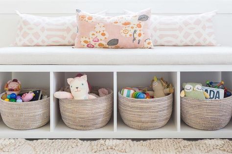 Alyssa Rosenheck - Amanda Barnes Interior Design - Ethereal girl's nursery features a white freestanding storage bench filled with gray woven baskets and lined with pink trellis pillows placed under a window. Kallax Bookshelf, Bookshelf Bench, Amanda Barnes, Nursery Details, Window Seating, Diy Playroom, Ikea Kallax, Playroom Design, Nursery Storage