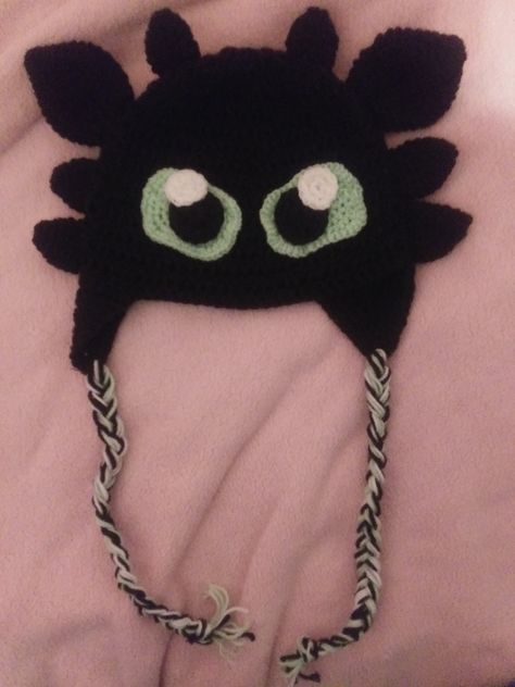 This is a crocheted hat I made for my brother. It is based off of Toothless from How to Train Your Dragon, using black, white, and mint green yarn. Crochet Character Hats, Green Yarn, Hats Black, Crocheted Hat, Train Your Dragon, Black Dragon, Toothless, How To Train, How To Train Your Dragon