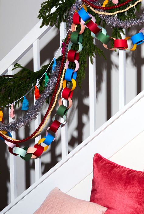 One easy way to upgrade your Christmas decor is by layering different types of garland. Use different textures and colors to create a dream whimsical Christmas living room. You can shop your old Christmas decorations, hit up your favorite home decor store, or DIY your own holiday garland. The more the merrier we say! #christmasgarland #layeredgarland #whimsicalholiday #bhg Layering Christmas Garland, Old Christmas Decorations, Christmas Staircase Decor, Christmas Staircase, Holiday Garland, The More The Merrier, Christmas Dining Room, Christmas Living Room, Tinsel Tree