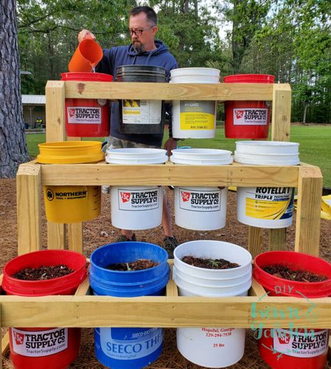 Limited Garden Space? Build a Bucket Planter Stand in One Afternoon Garden Stand Ideas, Five Gallon Bucket Garden Stand, 5 Gallon Bucket Planter Stand, Bucket Planter Stand, Container Garden Stand, Raised Container Garden, Bucket Garden, Tomato Planter, Small House Garden