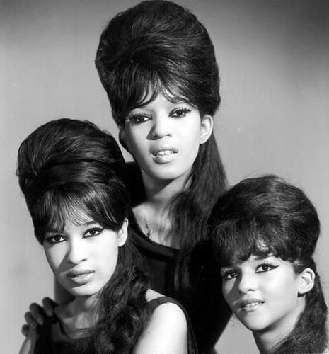 The Ronettes    		The Ronettes were a girl group of the 1960s from New York City, best known for their work with producer Phil Spector. They consisted of lead singer Veronica Bennett (a.k.a. Ronnie Spector), her sister Estelle Bennett, and their cousin Nedra Talley. Their defining album is Presenting the Fabulous Ronettes Featuring Veronica from 1963, and their most famous songs include "Be My Baby", "Baby, I Love You", "(The Best Part of) Breakin' Up", and "(Walking) in the Rain". Ronnie Spector, The Ronettes, 1960s Hair, Beehive Hair, Romeo Santos, Three Women, Walking In The Rain, Funky Hairstyles, Easy Listening