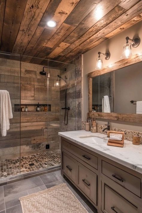 Blend rustic elements like wood and stone with sleek modern fixtures in your bathroom for a cozy yet contemporary feel. Use a wooden vanity, stone accents, and matte black hardware for a chic, modern rustic look. 🛁 Rustic Farmhouse Bathroom Ideas, Pond Building, Modern Farmhouse Bathroom Ideas, Rustic Bathroom Remodel, Farmhouse Bathroom Ideas, Rustic Farmhouse Bathroom, Bathroom Remodel On A Budget, Cabin Bathrooms, Architecture Bathroom