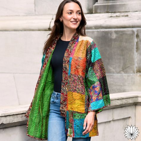 Fall in love with our new Reversible Kantha Silk Kimono Jacket! Perfect for layering over your autumn outfits, it adds a touch of elegance and warmth to any look! Handmade from up-cycled silk saris with intricate Kantha stitching, each piece is uniquely beautiful. Its reversible design (with pockets!) allows you to effortlessly switch up your style while embracing sustainable fashion. #ethicalstyle #indianartisans #MadeInIndia #SustainableStyle #FunFashion #fairtradegifts #Sustainable #Se... Kantha Silk, Silk Kimono Jacket, Rural India, Autumn Outfits, Silk Kimono, Summer Beauty, Kimono Jacket, Women Artisans, Patchwork Designs