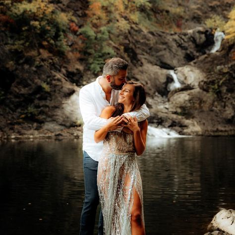 Outdoor engagement portrait of the couple hugging while the man kisses his fiancé on the head with a waterfall in the background Taken in Troy, New York.   #adventurouselopment #adventurousengagementshoot #coupleposes #waterfallcouplesshoot Water Fall Couple Photography, Adirondack Engagement Photos, Waterfall Engagement Photoshoot, Waterfall Picture Ideas Couple, Waterfall Couple Shoot, Engagement Photos Waterfall, Waterfall Couple Photoshoot, Waterfall Engagement Pictures, Vermont Elopement