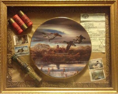 Duck call, duck stamps, hunting license shells, band & plate in shadow box Duck Hunting Man Cave, Hunting Theme Room, Wreath Arrangements, Duck Hunting Decor, Hunting Storage, Call Duck, Deer Antler Crafts, Hunting Theme, Hunting Themes