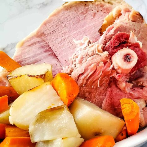 This slow cooker ham dinner is chock full of potatoes and carrots. Slow cooker ham and potatoes with carrots is popular anytime, but it's especially popular during the holidays, such as Thanksgiving, Christmas, and Easter. Why You Will Love This Recipe It is also incredibly easy to make, which is why it is such a popular recipe. Simply place all of the ingredients in your slow cooker and let it do the work for you. Crockpot Ham And Potatoes, Carrots Slow Cooker, Ham And Potatoes, Ham And Cabbage, Easter Sides, Boiled Ham, Boiled Dinner, Whole Ham, Slow Cooker Lamb