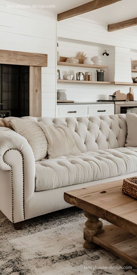 The elegant Chesterfield sofa brings a subtle luxury vibe, with its rich fabric and button-tufted details adding to the room's appeal. Beige Chesterfield Sofa, Beige Sofa Living Room, Chesterfield Sofa Living Room, Tufted Couch, Chesterfield Sofas, Subtle Luxury, Sofa Material, Beige Sofa, Tufted Sofa