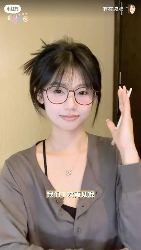 Short & Chic: Hairstyles with Bangs to Steal Cute Korean Bangs Hairstyles, Korean Hairstyle With Glasses, Short Layered Hair Ponytail, Hair Ideas Mid Length Style, Elegant Hairdos For Long Hair, Korean Spiky Bun, Long Hair Bangs With Glasses, Cute Korean Bun Hairstyles, Korean Ponytail With Bangs