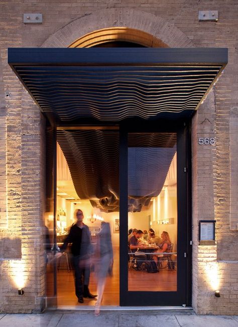 The teams chose micro density overlay (MDO) for the exterior ribs due to the material’s durability and weather resistance. Aidlin Darling, Restaurant Door, Restaurant Entrance, Kentish Town, Backyard Canopy, Porte Cochere, Hotel Entrance, Diy Canopy, Door Canopy