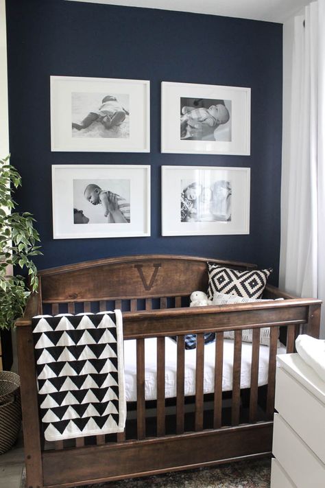 Nursery Room Babyboy, Nursery With Navy Crib, Nursery Navy Accent Wall, Nursery With Dark Wood Crib, Navy Grey Nursery, Navy Blue And Brown Nursery, Navy And Wood Nursery, Navy Wall Nursery, Dark Walls Nursery