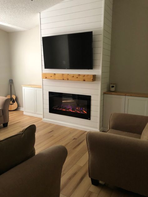 Vaulted ceiling entertainment center with shiplap, fireplace. Floating mantel. Cabinet on each side. Vaulted Ceiling Shiplap, Fireplace With Cabinets, Ceiling Shiplap, Diy Fireplace Mantle, Built In Around Fireplace, Fireplaces Layout, Vaulted Ceiling Living Room, Electric Fireplace Wall, Built In Electric Fireplace