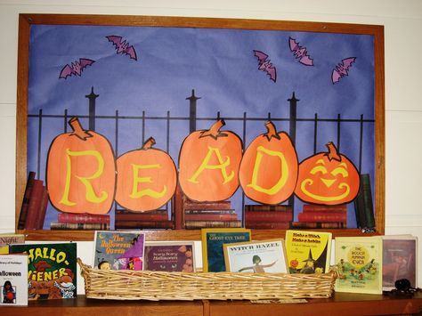 Book display; centerpiece for kids' art display - surround with jack-o-lanterns created by library kids Fall Library Displays, Halloween Library, School Library Displays, Library Bulletin Board, Halloween Bulletin Boards, Reading Bulletin Boards, October Ideas, Library Book Displays, Elementary School Library