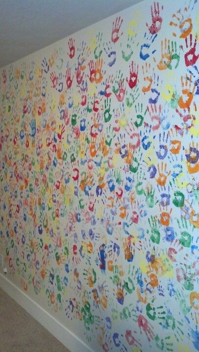 My children's hand prints now cover and brighten my home office wall.  One room ill never repaint!! Hand Print Wall Decor, Hand Print Mural, Painting School Walls Ideas, Handprint Wall Mural, Freehand Wall Painting, Hand Print Ideas Memories, Kindergarten Wall Painting, Hand Print Wall, Lkg Class Wall Painting