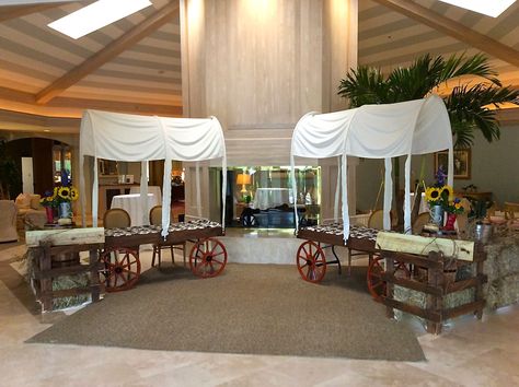 Western themed party decorations.  Chuck wagon check-in tables built around a 6' banquet tables.  Designed by Steven Bowles Creative, Naples, Florida, Florist and Event Designer. www.stevenbowlescreative.com Western Themed Party, Country Western Parties, Decoration Buffet, Wild West Party, Western Theme Party, Cowboy Decorations, Chuck Wagon, Wilde Westen, Western Parties