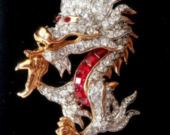 Crystal brooch swarovski | Etsy Dragon Brooch, Swarovski Swan, Dragon Jewelry, Jewelry Pins, Crystal Brooch, Themed Jewelry, Swarovski Jewelry, Red Crystals, Pin Brooch