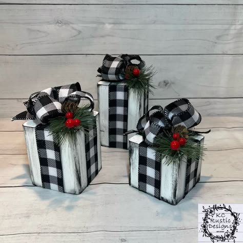 "These beautiful square wooden Christmas presents are perfect for your Christmas decor. They are perfect to add to any space!  You'll be getting a trio. They measure approximately: Large present is 5\" X 3.5\" Medium present is 4\" X 3.5\"  Small present is 3\" X 3.5\" With the ribbon and greenery on top gives about another inch in height. These are solid and heavy.  All are hand painted. I use buffalo plaid ribbon, greenery, berries and a pinecone to decorate these adorable wooden presents. All Wooden Christmas Presents, Wood Christmas Gifts, Wooden Presents, Christmas Shelf Decor, Wood Blocks Christmas, Decoration Buffet, Christmas Shelf, Woodland Whimsy, Buffet Decor