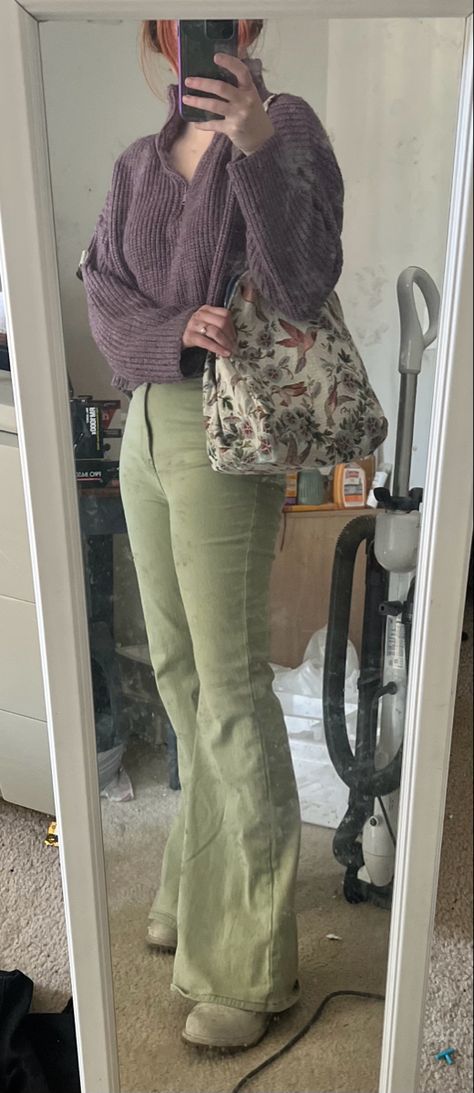 Green flare jeans, purple sweater, timberland boots, and vintage upholstery purse Light Green Flare Pants Outfit, Olive Flare Pants Outfit, Lavender And Olive Green Outfit, Green Bootcut Pants Outfit, Purple Green Outfit Aesthetic, Green Flares Outfit, Green Flare Jeans Outfit, Green Trousers Outfit Winter, Green Flared Pants Outfit