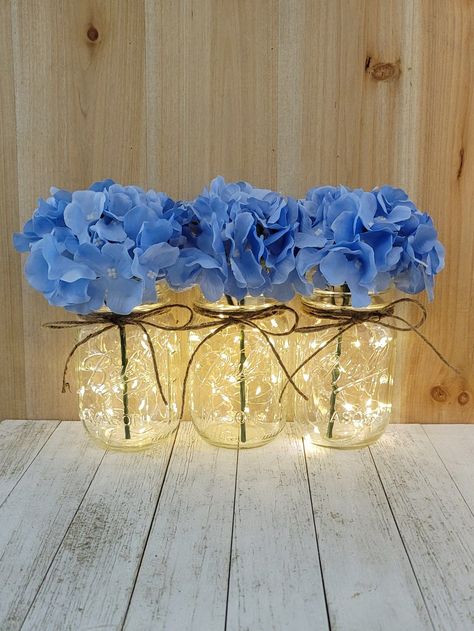 Baby Blue Decorations, Mason Jar Wedding Centerpieces, Blue Bridal Shower Decorations, Mason Jars With Lights, Quinceanera Winter Wonderland, Jar Centerpiece Wedding, Blue Wedding Decor, Wedding Centerpieces Mason Jars, Baby Blue Weddings