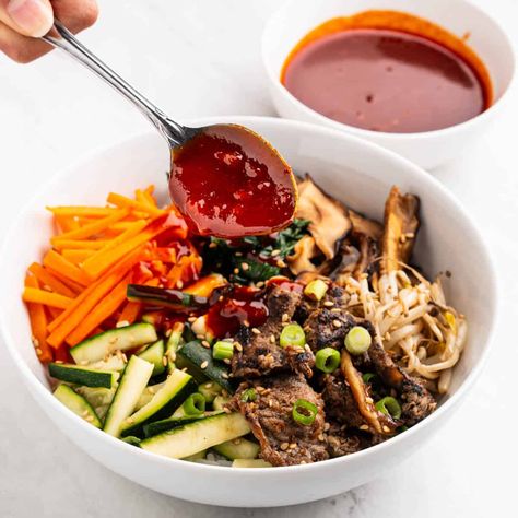 This easy bibimbap sauce recipe combines gochujang, sesame oil, and garlic for a bold, spicy, and flavorful Korean condiment. Easy Bibimbap, Bibimbap Bowls, Bibimbap Sauce, Korean Sauce, Korean Cucumber Salad, Bibimbap Bowl, Korean Bibimbap, Korean Cucumber, Bulgogi Beef