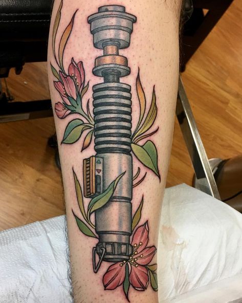 Something similar but with kylo’s saber and forget me nots?? Luke Skywalker Lightsaber Drawing, Luke Lightsaber Tattoo, Luke Skywalker Lightsaber Tattoo, Lightsabers Tattoo, Luke Skywalker Tattoo, Star Wars Lightsaber Tattoo, Lightsaber Tattoos, Lightsaber Tattoo, Nerd Tattoos