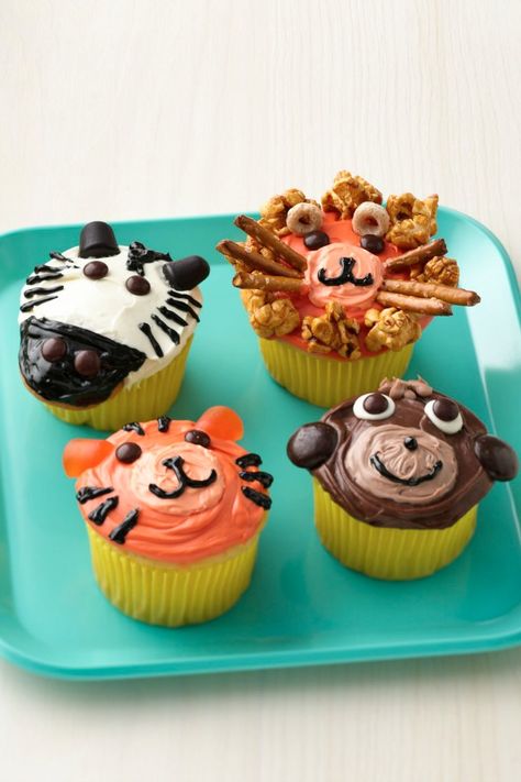 Lions, tigers, zebras and monkeys, oh my! These adorable jungle animals are almost too cute to eat. The decorations look complicated, but they’re actually extremely easy with the help of a few candies. “I made these for my son’s birthday at school and for his birthday part and they are definitely winners!” says Betty member DangersMom. Cupcakes Safari, Cupcake Recipes For Kids, Farm Animal Cupcakes, Betty Crocker Cake, Orange Frosting, Fancy Cupcakes, Kid Cupcakes, Animal Cupcakes, Circus Birthday Party