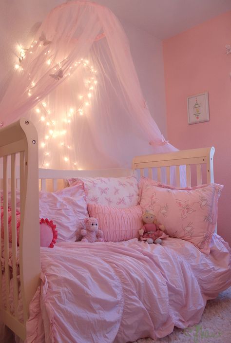 Add some sparkle to the room with mini LED lights! I used small adhesive hooks to create the heart shape with the lights, and chose a white cord instead of green. Because this is a toddler room, these lights aren't always turned on. Leave that for special evening story times, or turn them on and off with a timer attachment. Evening Story, Butterfly Room, Toddler Bedroom Girl, Princess Bedroom, Toddler Girl Room, Adhesive Hooks, Princess Room, Toddler Rooms, Toddler Bedrooms