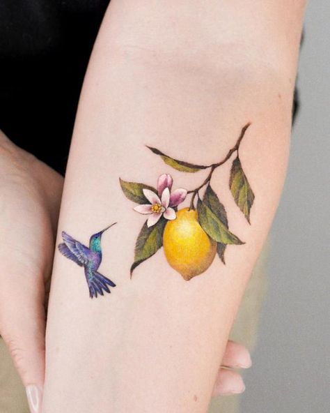 40+ Lemon Tattoos: Meaning and Designs Traditional Tattoo Symbols, Rebirth Tattoo, New Beginning Tattoo, Lemon Branch, Green Tattoos, Basic Tattoos, Ribcage Tattoo, Branch Tattoo, Blossom Tattoo