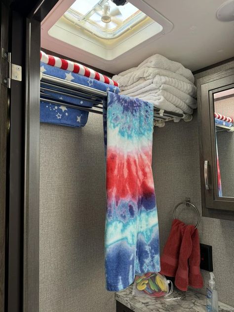 RV Hacking Camping Ideas | Couldn’t figure out where to store my towels so they wouldn’t take up a whole closet | Facebook Small Camper Clothes Storage Ideas, Rv Towel Storage Ideas, Rv Closet Storage Ideas, Camper Cat, Dirty Laundry Storage, Jacket Storage, Happy Glamper, Rv Camping Tips, Camper Hacks