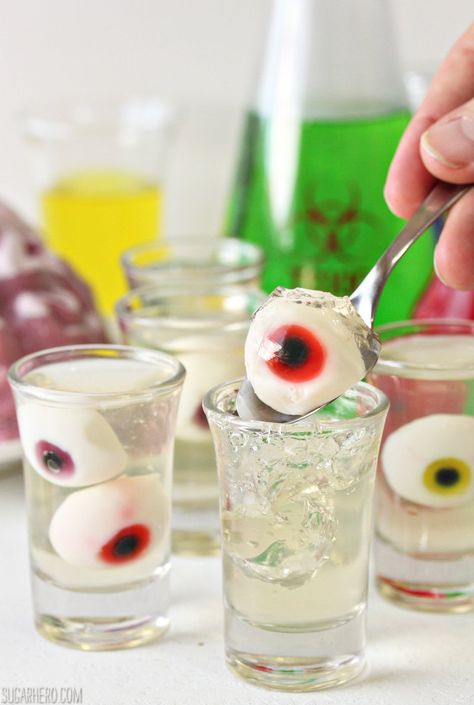 Floating Eyeball Jello Shots | From SugarHero.com Eyeball Jello Shots, Eyeball Jello, Floating Eyeball, Strawberry Jello Shots, Candy Corn Jello Shots, Champagne Jello Shots, Best Jello Shots, Halloween Jello Shots, Scary Halloween Food