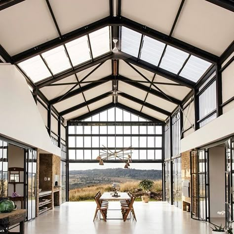 What a view! What a view!! What a mighty good view!! . There’s so many barndominium ideas in this unique home located on 80 acres in Pretoria, South Africa. . The combination of steel and glass in the central part of this “barn-inspired design” is amazing! So much light!....and oh, the polished concrete floors are beautiful! . It is an unconventional residential floor plan for sure. I really like the idea of a central, open space area with the other rooms radiating out on the sides. Conservatory House, Farmhouse Barndominium, Container House Plans, Casa Container, Shipping Container House, Container House Design, Metal Building Homes, Shipping Container Homes, Architect House