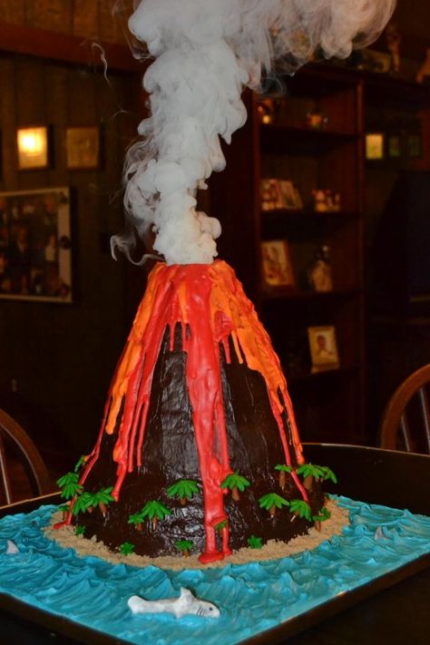 Volcano cake Volcano Birthday, Volcano Projects, Volcano Cake, Erupting Volcano, Science Birthday, Kid Science, Science Party, Luau Birthday, Dinosaur Cake