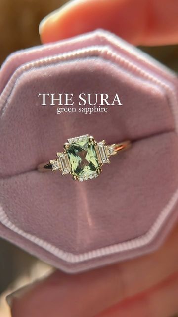 Brianna Trudell on Instagram: "New week, new Sura! This ring features a 1.1 CT unheated radiant green sapphire, set in 14K yellow gold. She will be available on Friday! #rings #engagementring #greensapphire #sapphireengagementring #lavendercreekgems #gemstoneengagementring #artdecoengagementring" The Sura Engagement Ring, Sapphire Green Engagement Ring, Green Sapphire Engagement Ring Gold, Engagement Rings Green Sapphire, Green Sapphire Ring Engagement, Sura Ring, Light Green Sapphire Engagement Ring, Light Green Engagement Ring, Engagement Rings Color