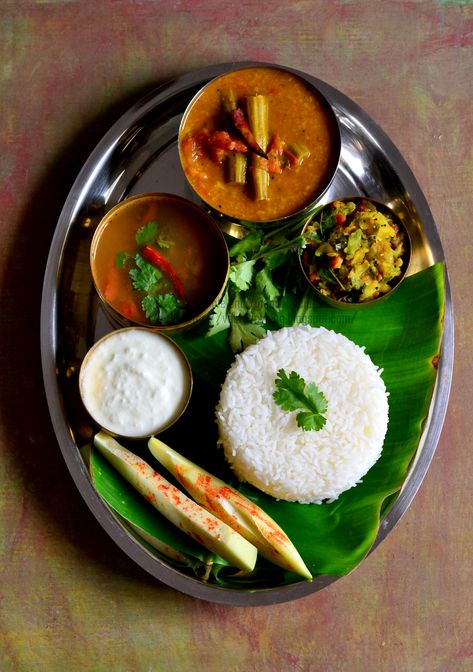 The staple food of Tamilnadu is Rice. We usually have rice for lunch along with some gravy made with lentils, rasam, stirfried vegetables called poriyal in Tamil or kootu i.e vegetables and lentils are cooked together & semisolid in consistency and finally curd. These 4 items are must in our lunch menu. Healthy Food For Dinner, Cooking Recipes Veg, Food For Dinner, Indian Food Photography, Rice Recipes For Dinner, Easy Rice Recipes, State Foods, Recipes In Tamil, Food Critic