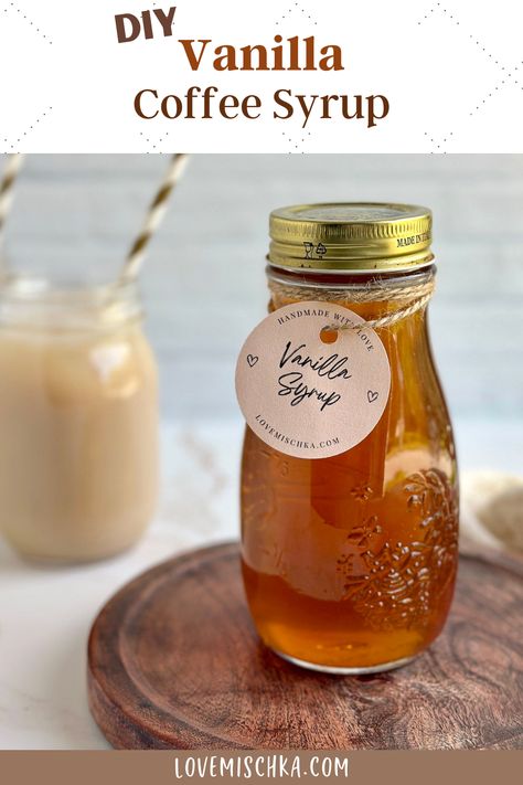 Golden brown vanilla simple syrup for coffee in a mason jar canning bottle with a circular, pinkish label that says, "Vanilla Syrup" sits on a circular, dark brown, wooden serving board, next to tan, iced vanilla chai lattes in mason jar glasses with gold and white stripped paper straws. Vanilla Syrup For Coffee, Low Carb Starbucks, Vanilla Extract Recipe, Coffee Syrup, Vanilla Syrup, Vanilla Coffee, Syrup Recipe, Homemade Vanilla, How To Make Homemade