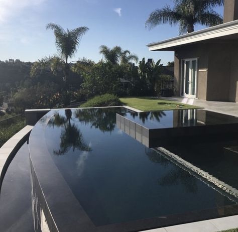 Black Bottom Pools Modern, Black Bottom Pool Design, Swimming Pool Black Tiles, Black Mini Pebble Pool Finish, Black Pool Aesthetic, Black Pool Tiles Waterline, Dark Swimming Pools, Black Infinity Pool, Dark Swimming Pool Aesthetic