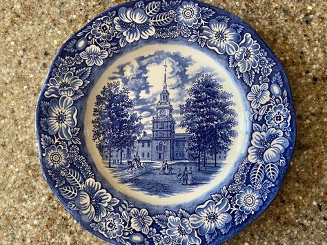 PLEASE READ DESCRIPTION: A lovely gift! Collectible Vintage Liberty Blue INDEPENDENCE HALL PHILADELPHIA Cobalt Blue Scenic Plate.  Estate item.   Made in Staffordshire England from original copper engravings of historic colonial scene!  Beautiful to decorate a wall or on a plate stand.   It is 9 7/8 inches in diameter. Excellent condition--no chips or cracks.  Clean and smoke-free.  Great for the Cobalt Blue, Blue Willow, Victorian, American History and English Plate Collector! See other similar Independence Hall Philadelphia, Blue And White Dinnerware, Decorate A Wall, Independence Hall, Copper Engraving, Liberty Blue, Plate Stand, English Antiques, Plate Stands