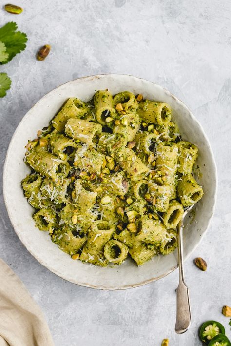 Flavorful cilantro pistachio pesto made with fresh cilantro, roasted pistachios, garlic, lime juice and a kick of heat from jalapeño. This easy pistachio pesto recipe comes together in just five minutes and is delicious on pasta, chicken, fish and more. Skip the store bought pesto for good! #pesto #pistachios #vegan #dairyfree #cilantro #sauce Moroccan Stew, Roasted Pistachios, Healthy Pesto, Cilantro Pesto, Pistachio Recipes, Pistachio Pesto, Pasta Chicken, Cilantro Sauce, Ambitious Kitchen